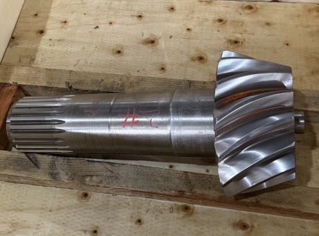Precision spiral bevel gears for smooth meshing.